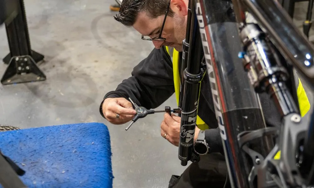 Mechanic working brakes