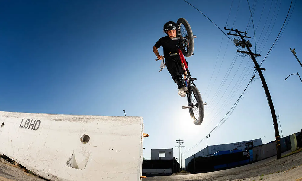 a bmx jumps through the air