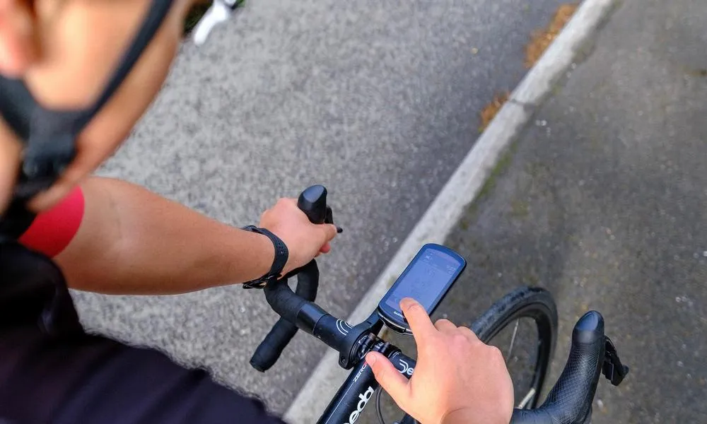 cyclist using their bike computer