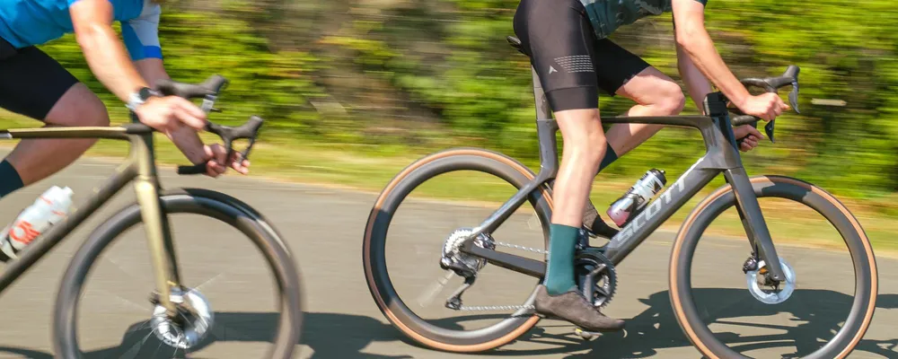 road cyclists close up with bottles