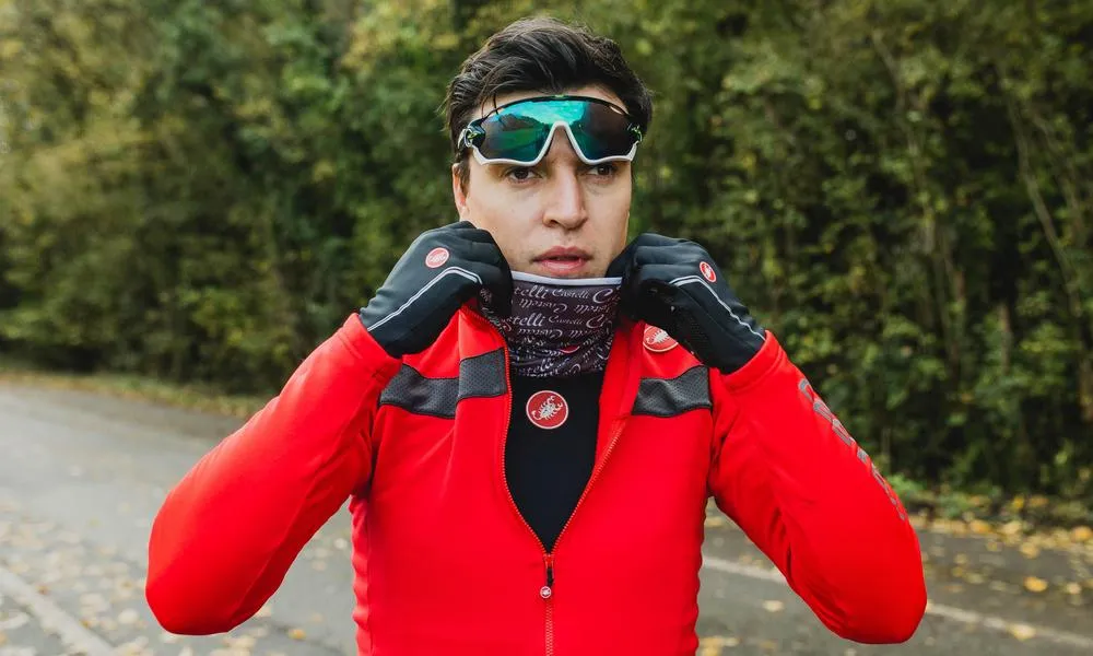 Cyclist getting kitted up with Thermal cycling gear