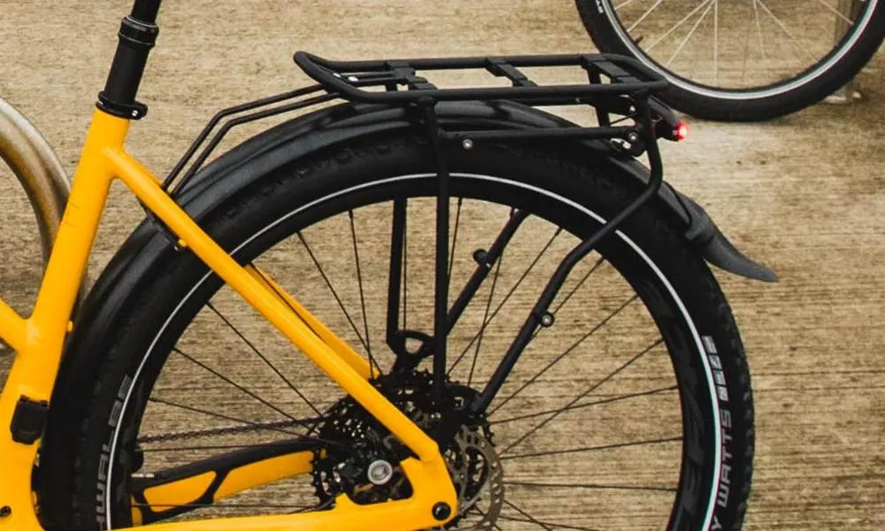 rear of an urban e-bike showing mudguards and rear rack