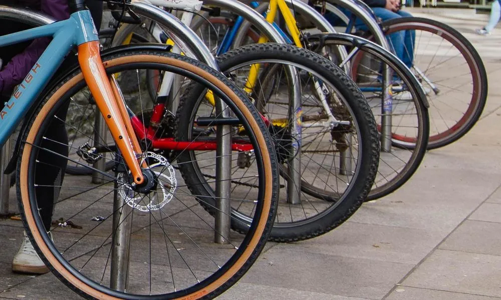 bike wheels in bike stand on steet