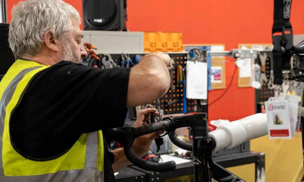 Bike mechanic using park tool screw driver