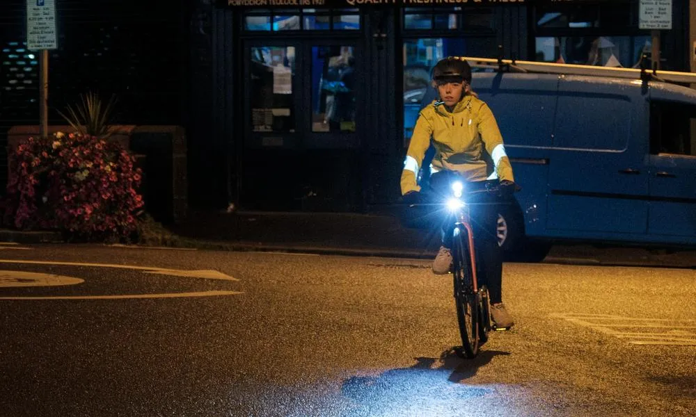 cyclist at night in hi vis clothing