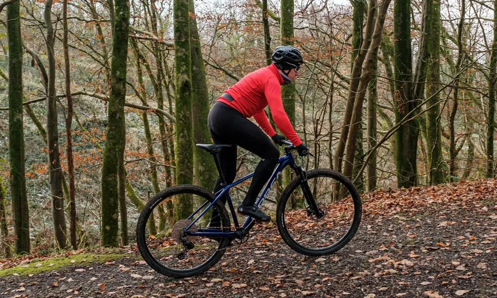 Cyclist riding a hardtail mountain bike uphill