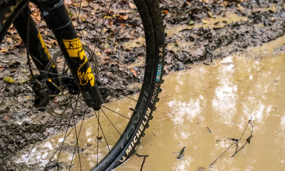 michelin tyre on muddy puddle