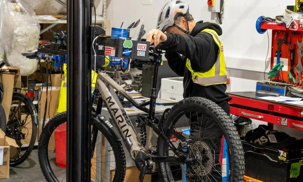 Bike mechanic working on a marin bike