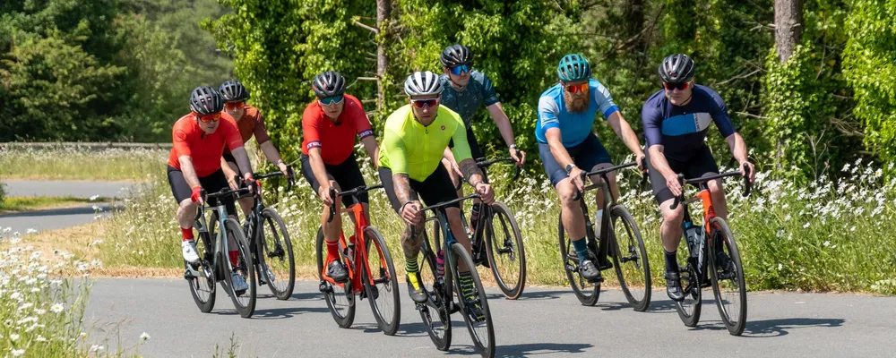 group of road cyclists riding the Pembrey Welsh closed road circuit on a sunny day