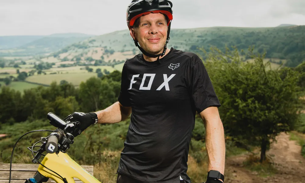 Rider standing wearing a Fox tshirt