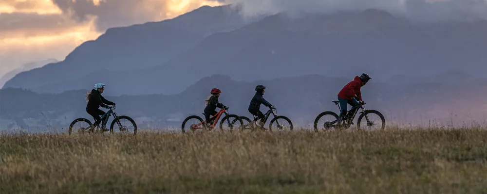 a family ride electric kids and junior bikes in the mountains