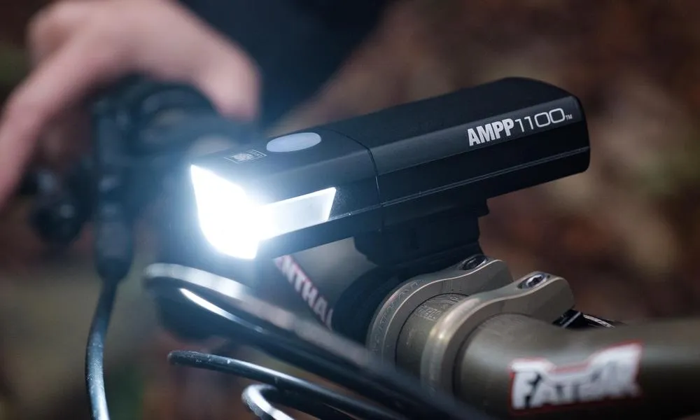 Cateye Ampp 1100 bike light mounted on mtb handlebars