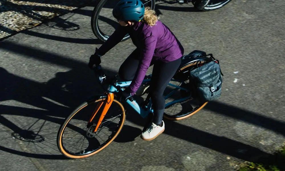 woman cycling in white shoes