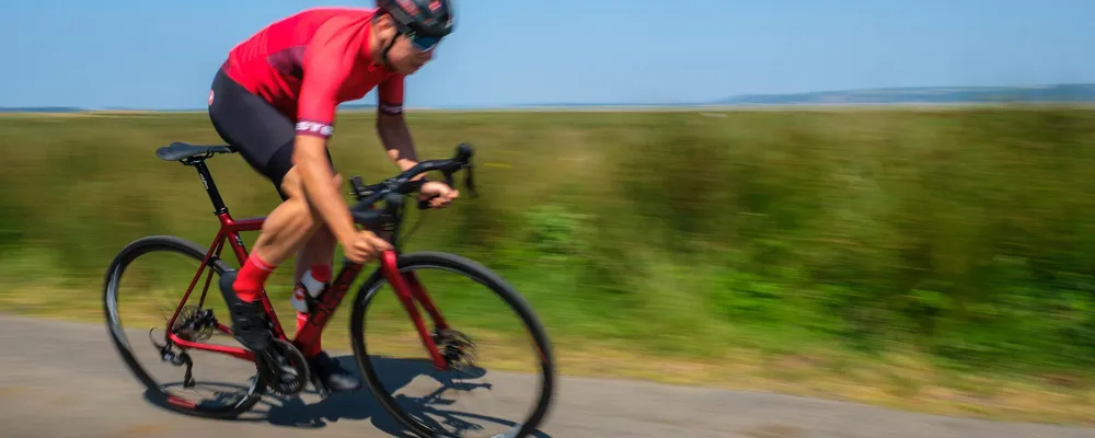 a road bike races past at speed