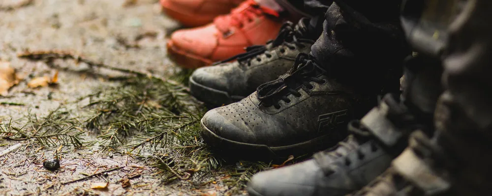 Three pairs of MTB shoes next to each other