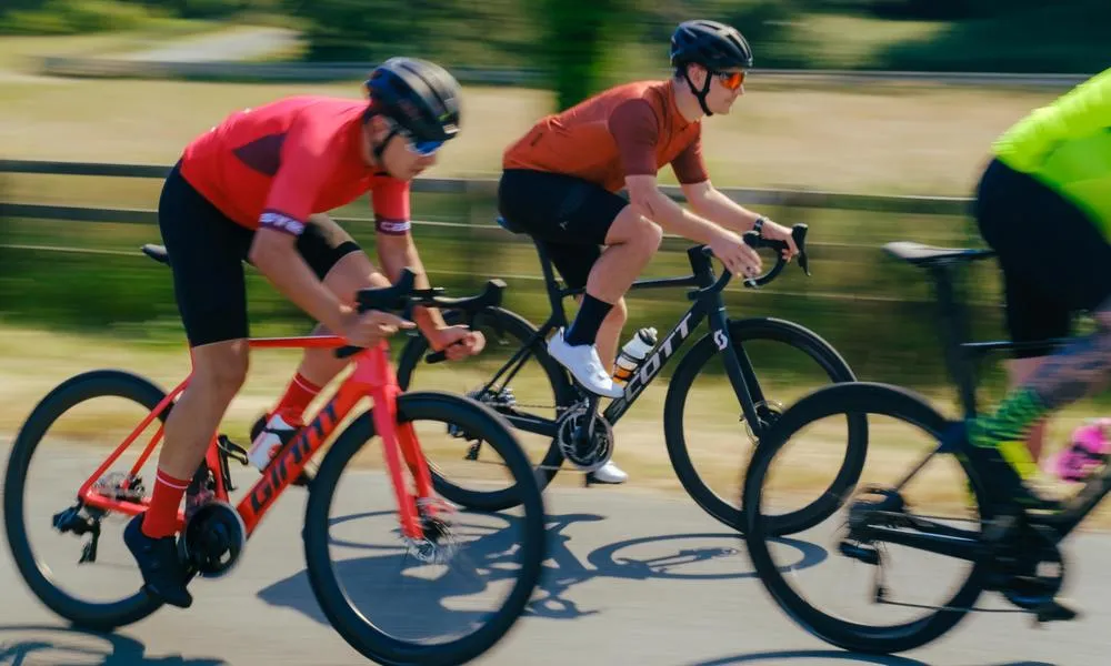 road cyclists riding fast