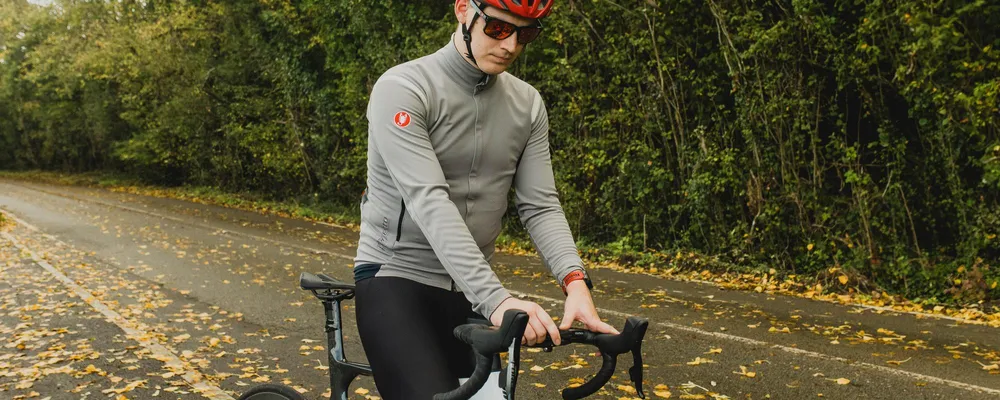 cyclist adjusting their bike computer