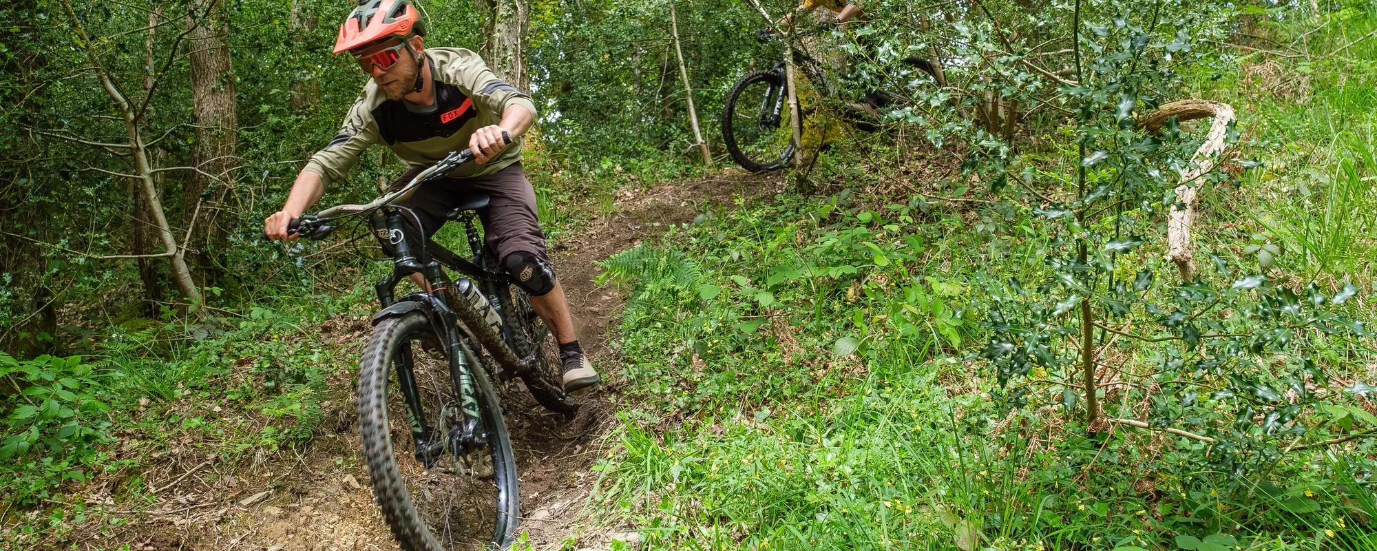 rider descending on Orange Crush hard tail