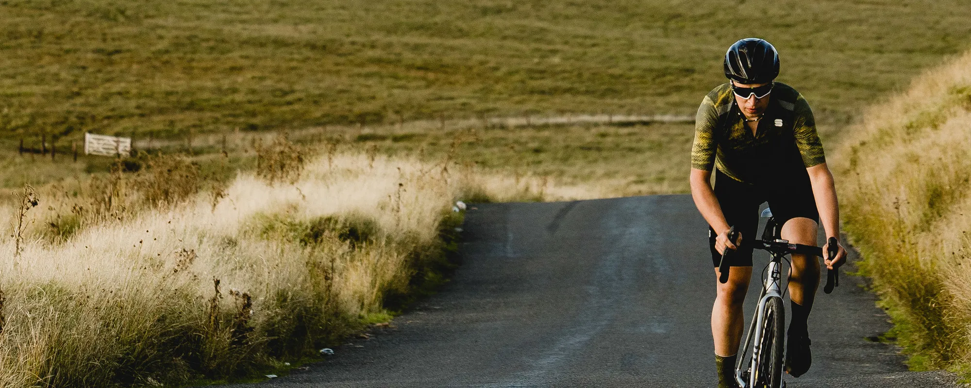 rider on the road in green sportful kit