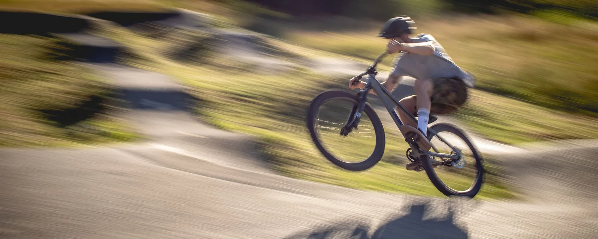 Rider on DMR bike at pump track