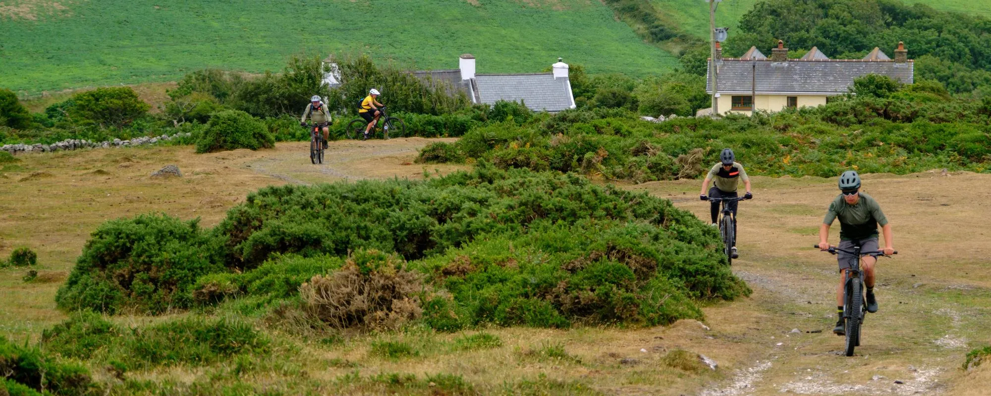 mountain bikers in a line on track 