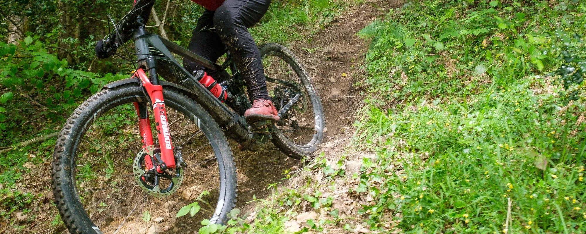 red marzocchi forks on mountain bike trail