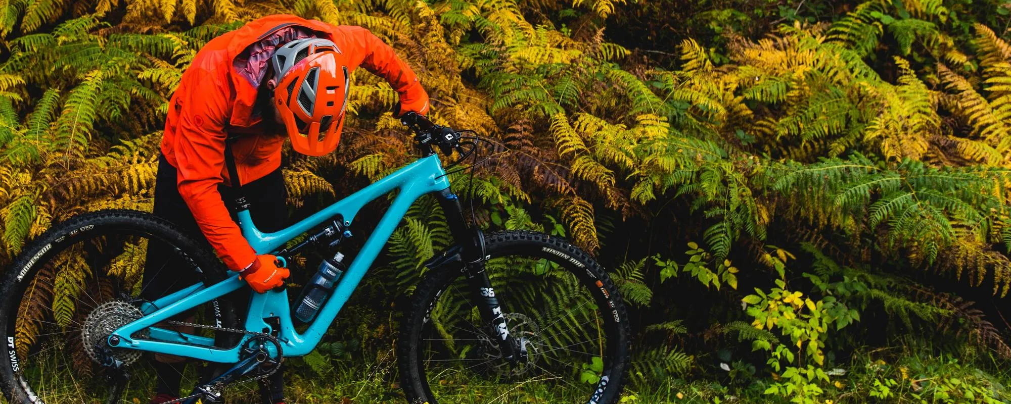 Mountain biker fixing his bike on the trail