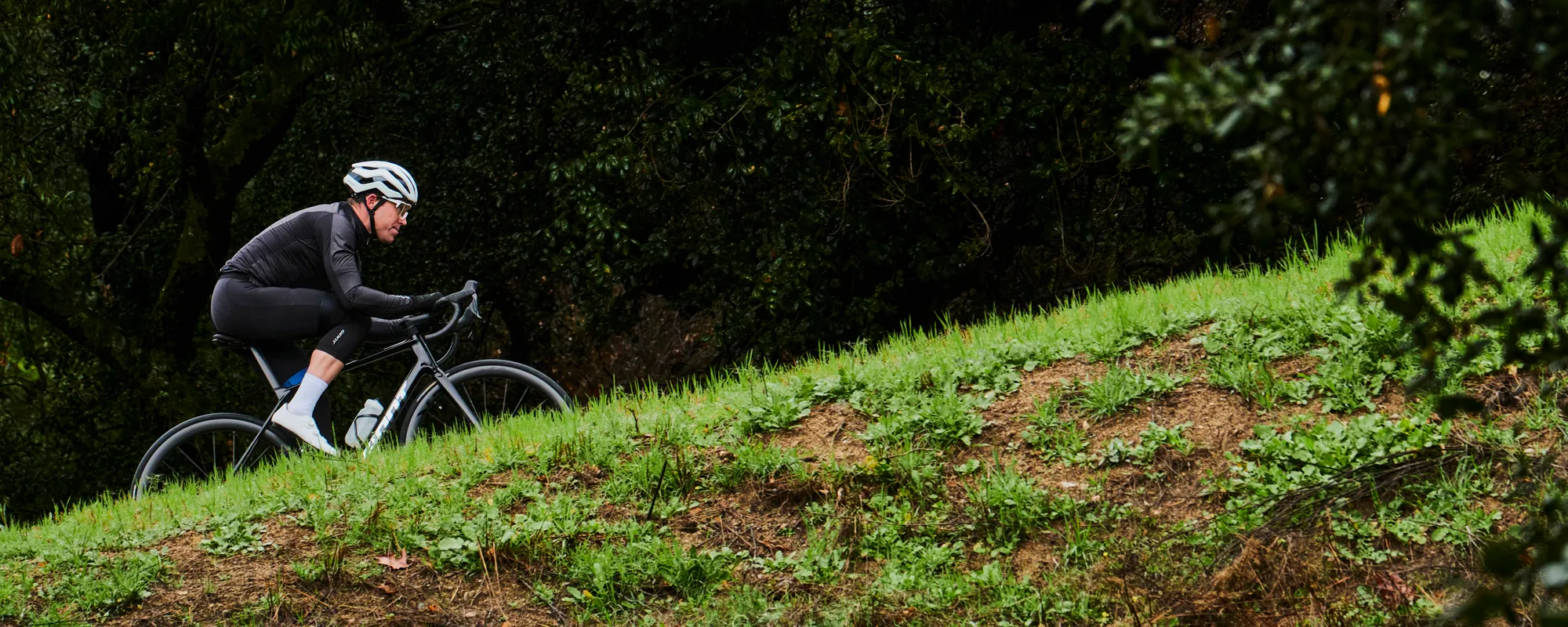 a Giant road bike is ridden uphill