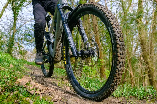 mountain bike tyre rolling on dirt 