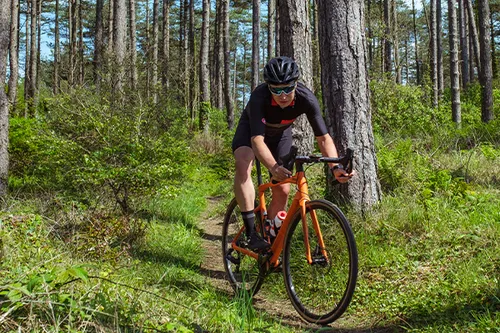 riding a gravel bike in the woods