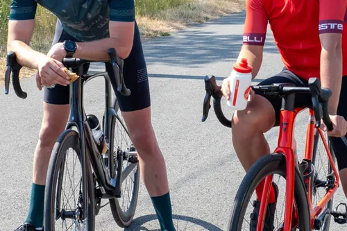 cyclists eating and drinking