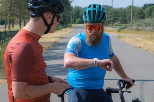 cyclist looking at watch