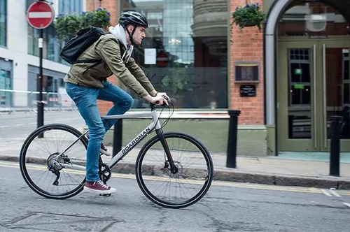 riding a boardman hybrid bike on city streets