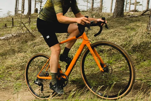 riding a gravel bike in cycling shorts