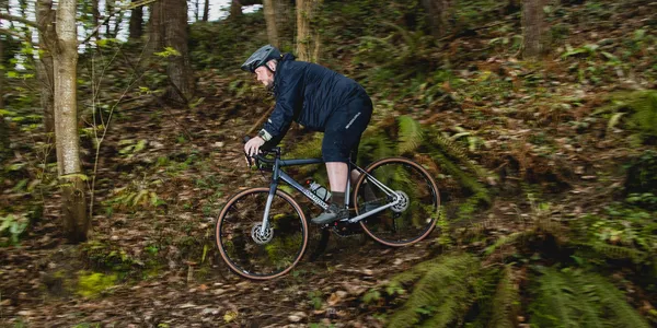 A gravel bike being used on an MTB trail