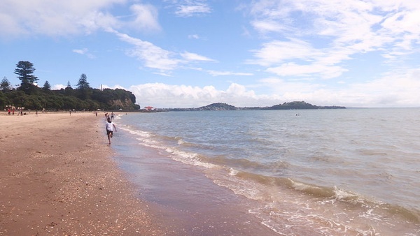 Photo of a child running on the Mission Bay beach
