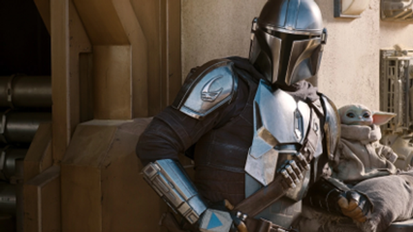 Picture of a person in a futuristic silver helmet and armor