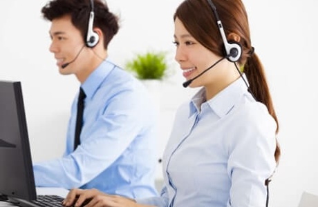 Local customer service agents working at computer