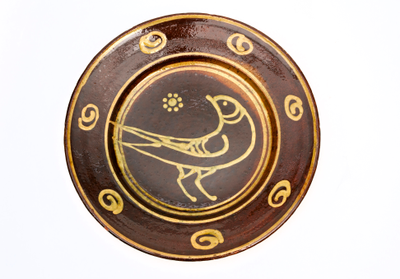 Photograph: Slipware dish by Michael Cardew at Winchcombe Pottery.