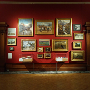 Photograph: The main exhibition gallery, Gallery A, at the Shipley Art Gallery - contemporary ceramics displayed amongst the paintings collection, including charger plates by Clive and Dylan Bowen, and vessels by Betty Blandino