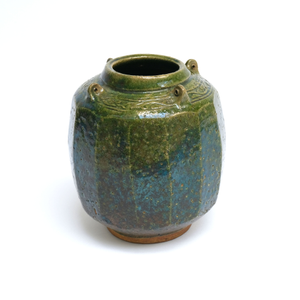 Photograph: Green vase with cut sides, pierced lugs and incised decoration on the shoulder, Bernard Leach, 1925-6. KM 1394