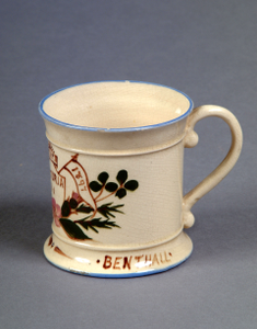 Photograph: Late nineteenth century Benthall Pottery Co. of Broseley small tankard mug.  Produced for Queen Victoria's Diamond Jubilee in 1897.