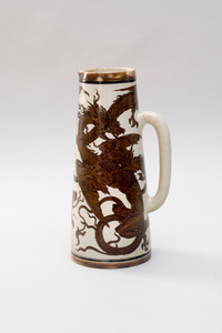 Photograph: Stoneware water jug with incised dragons, 1894 by the Martin Brothers.