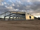 Large data center metal building construction site at sunset 