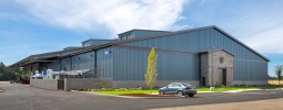 Large metal building with brick and wood front entrance at Jackson Family Winery