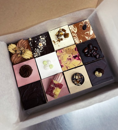 A box of plant-based sweet treats ready to be delivered to an event