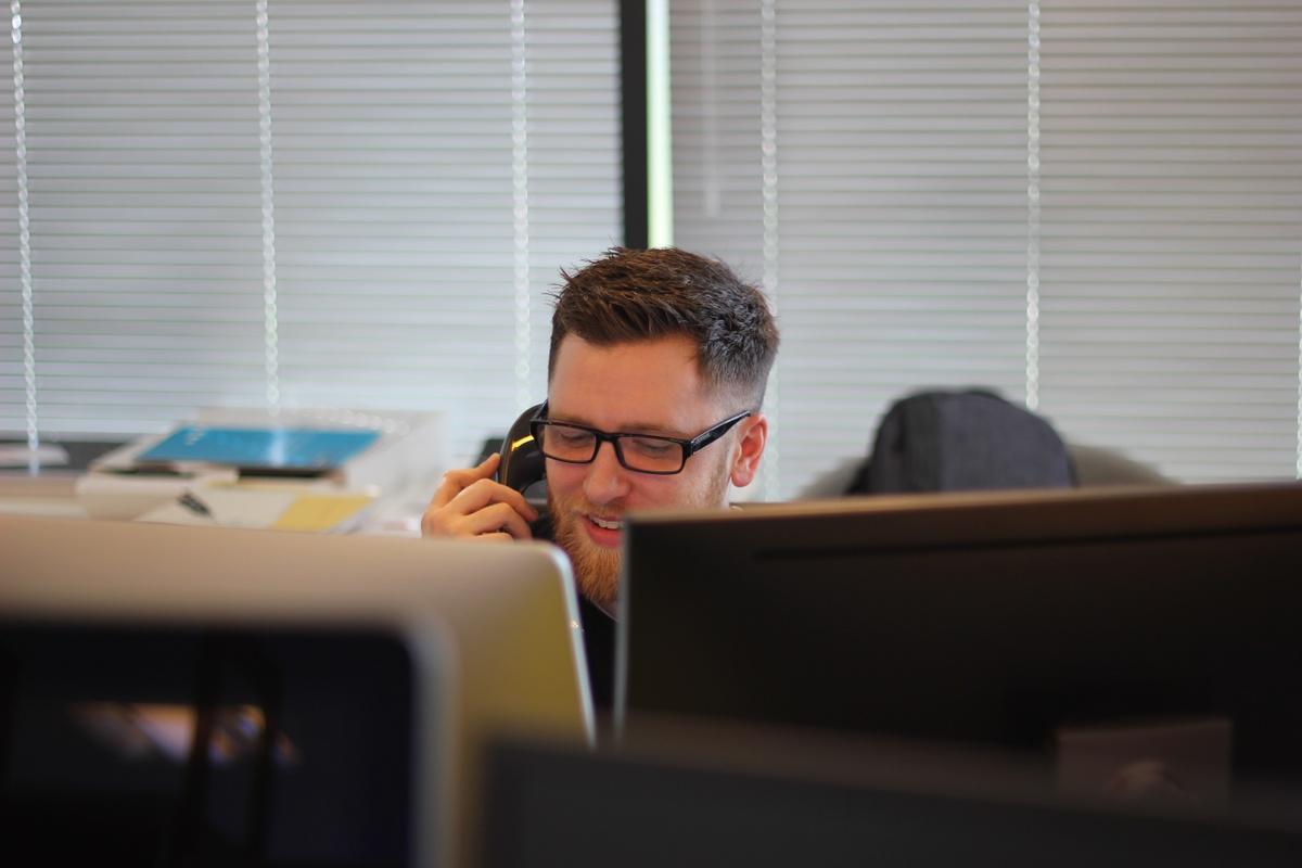 Man using phone inside office