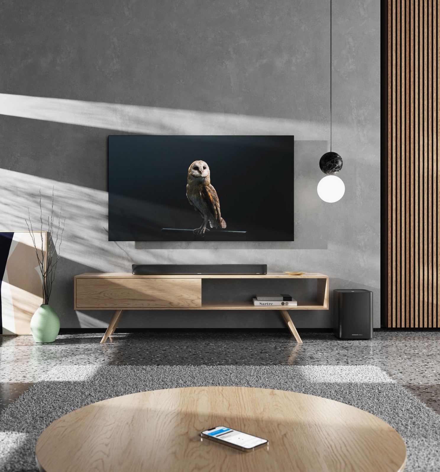 salle tv avec ambeo soundbar plus contrôlé par app
