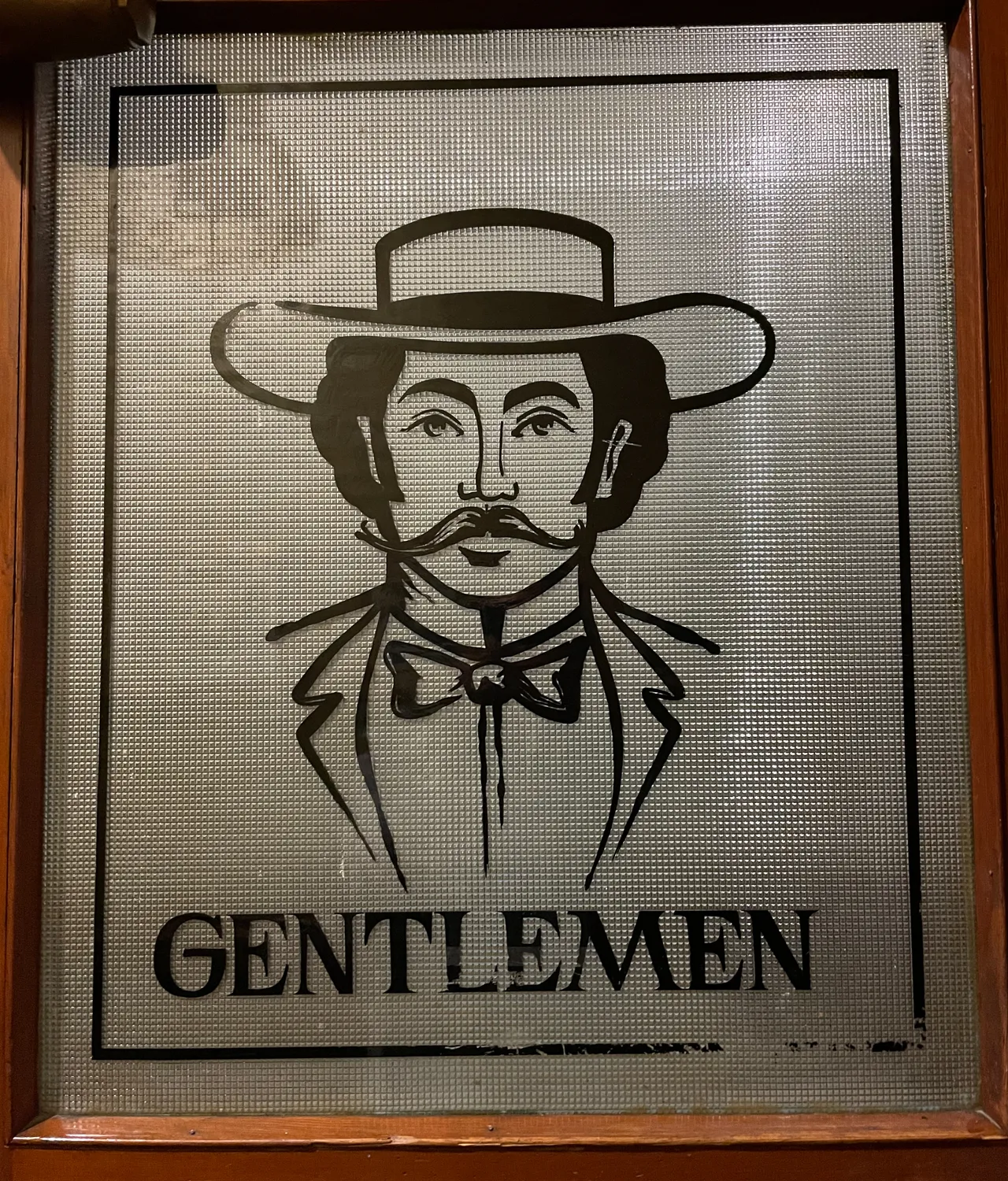 Gentlemen's restroom door