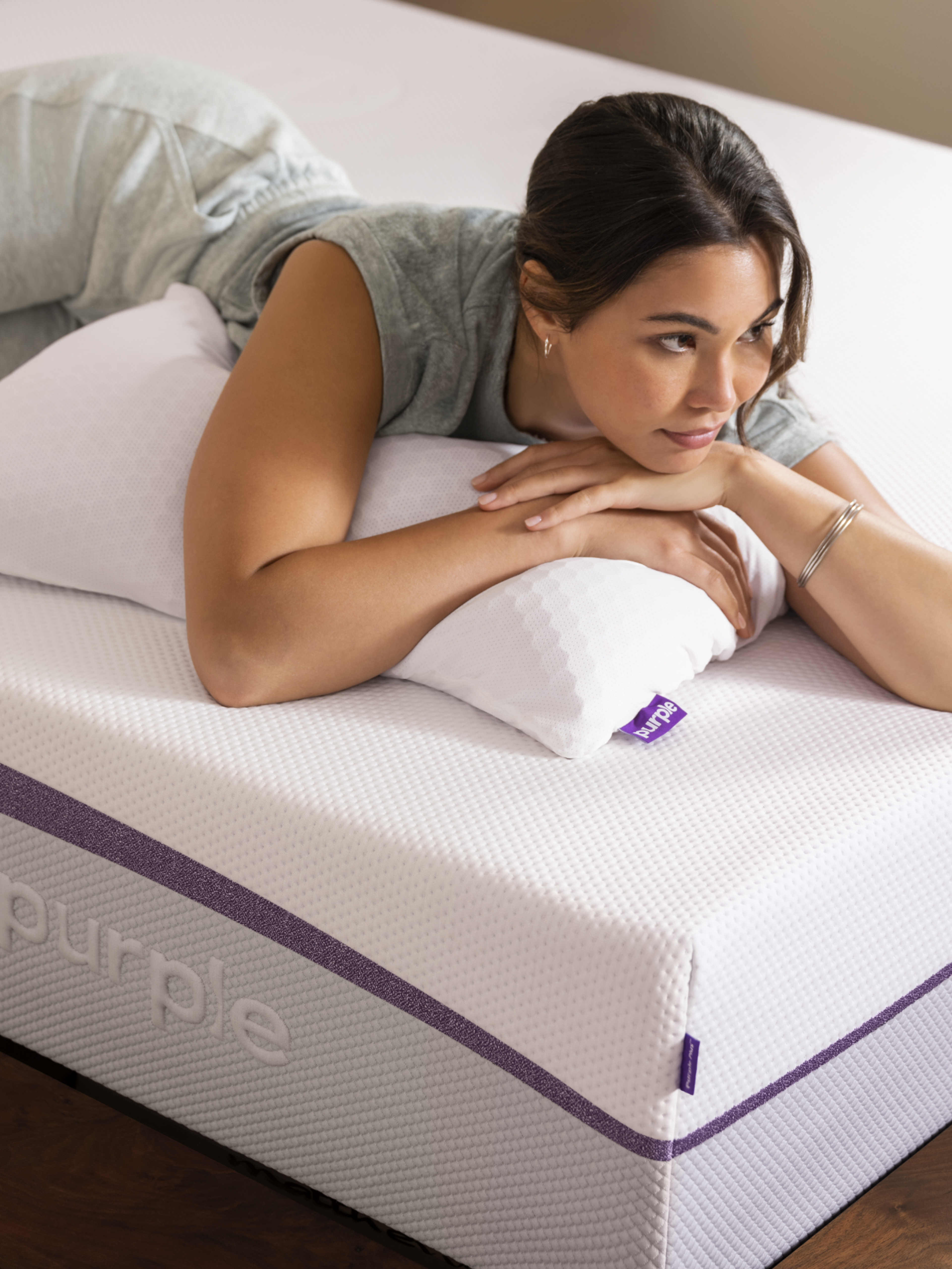 Woman on purple mattress